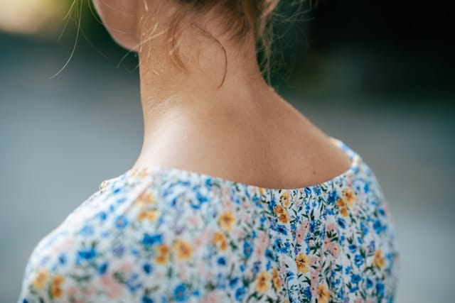 Close-up of neck and shoulders showing area where tension commonly accumulates, relevant to somatic tension relief practices